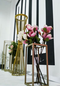 Close-up of pink flower vase on table at home