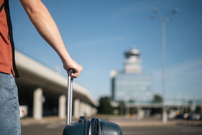 Travel by airplane. traveler is walking from parking lot to airport terminal. 