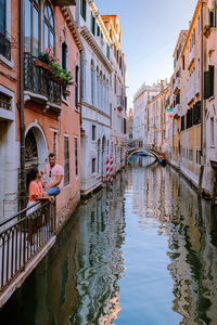 Canal amidst buildings in city