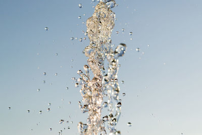 Close-up of splashing water against white background