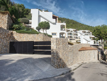 Charming hillside houses complex. south hill side, port d andratx, mallorca island, spain