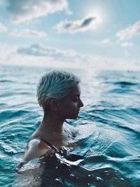 Portrait of woman swimming in sea