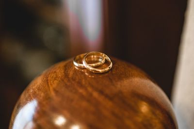 Close-up of wedding rings on table