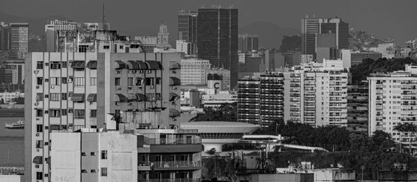 Modern buildings in city against sky