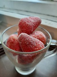 Close-up of strawberries in glass bowl on table