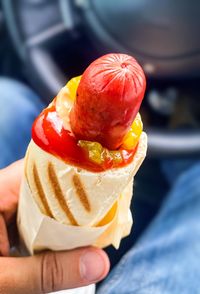 Close-up of hand holding ice cream