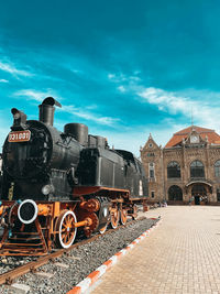 Train on railroad tracks against sky