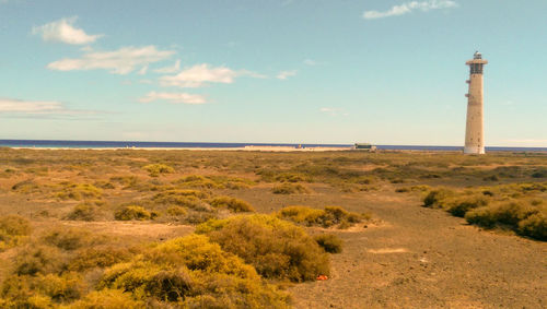 Scenic view of sea and buildings against sky