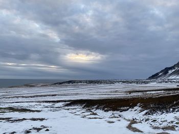 Scenic view of sea against sky during winter