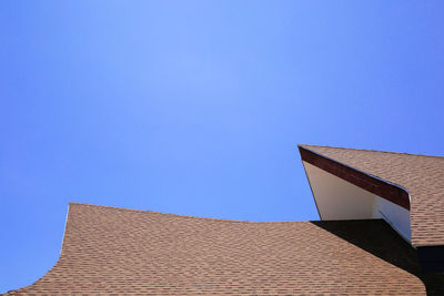 Low angle view of building against blue sky