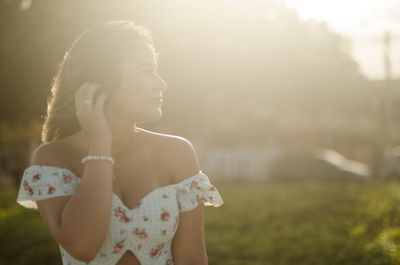 Midsection of woman looking away