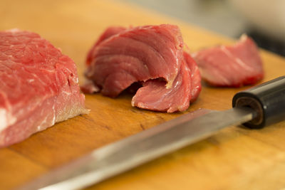 Close-up of meat on cutting board