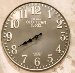 Close-up of clock on wall