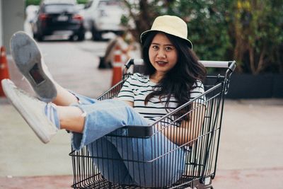 Portrait of smiling young woman in car