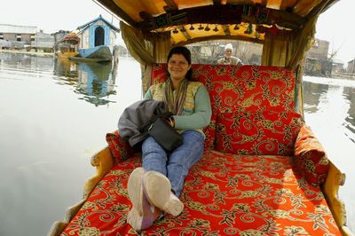 Portrait of young woman sitting in water