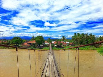 View of railroad tracks against cloudy sky