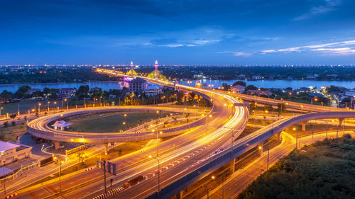 High angle view of light trails on road at night