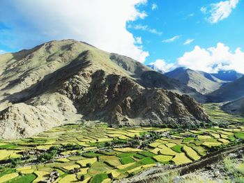 High angle view of mountain range against cloudy sky