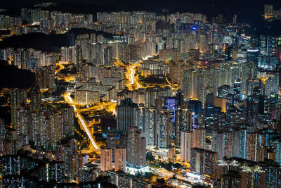 High angle view of city lit up at night