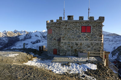 Buildings against clear sky during winter