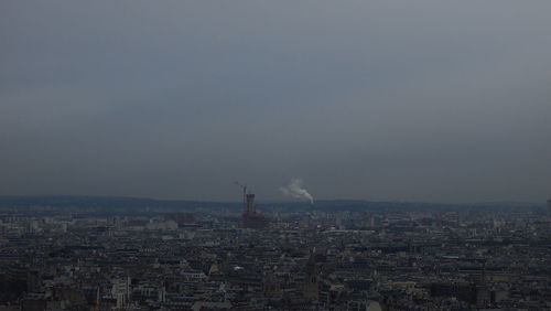 Cityscape against sky at dusk