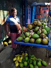 Green fruits for sale at market stall