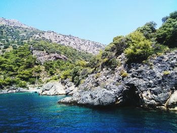 Scenic view of sea with mountain in background