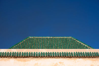 Low angle view of building against clear blue sky