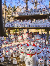 A large group of maneki nekos at the gotokuji temple, tokyo, japan.