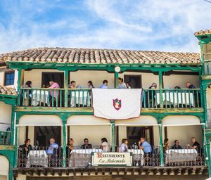 Group of people in building against sky