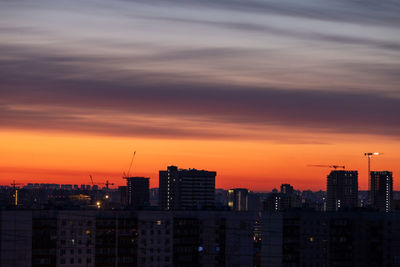 Cityscape against sky during sunset