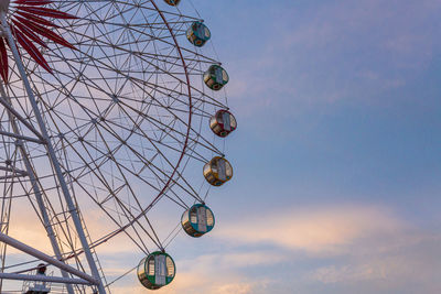 Low angle view of ferris wheel against sky