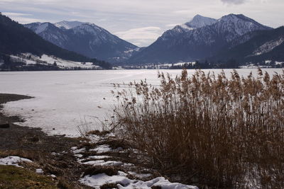 Scenic view of frozen lake against mountains