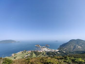 Scenic view of sea against clear blue sky