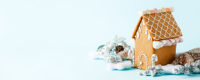 Close-up of toys on table against white background