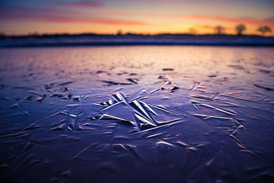 Beautiful close-up of a frozen ice formations on the water surface. natural winter texture.