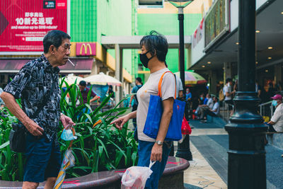 Friends standing at market