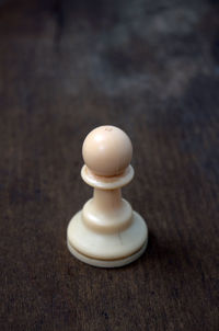 Close-up of white candle on table