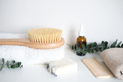Massage wooden body brush. dry lymphatic drainage massage and spa treatments.
