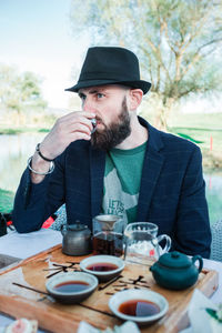 Man drinking tea ceremony on table