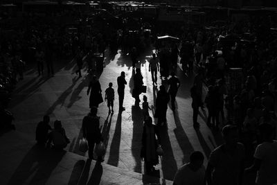 High angle view of silhouette people on street