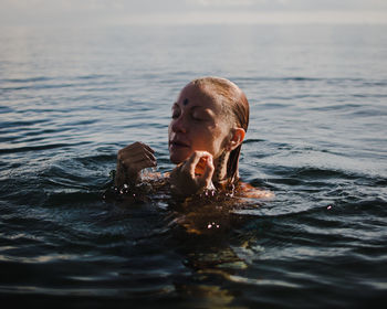 Portrait of man swimming in sea