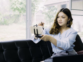 Young woman using mobile phone