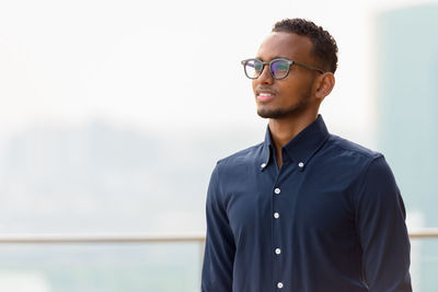 Young man looking away outdoors