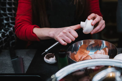 Midsection of woman preparing food