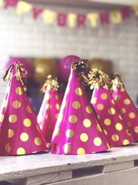 Close-up of pink umbrella on table