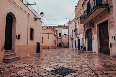 Alley amidst buildings in city