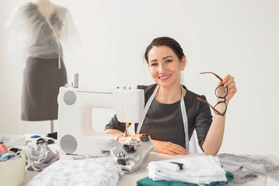 Portrait of a smiling young woman working