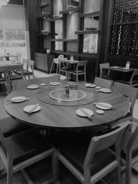 Empty chairs and tables in restaurant