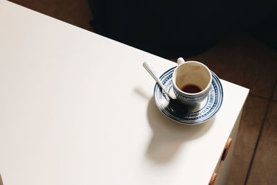 High angle view of coffee cup on table